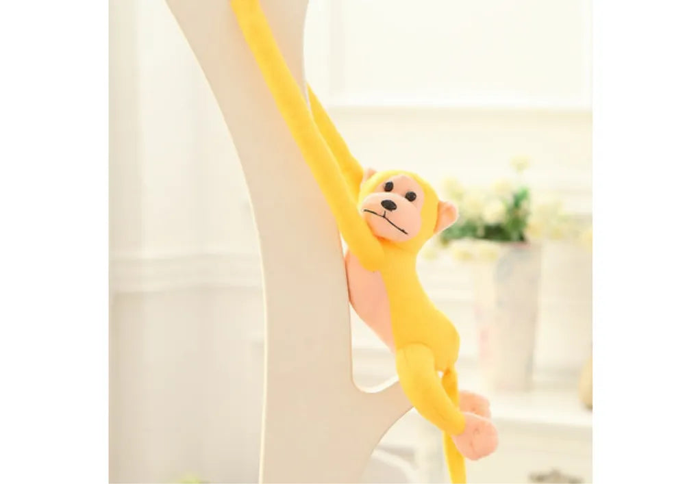 Pliušinė beždžionė su garsu geltona 80 cm